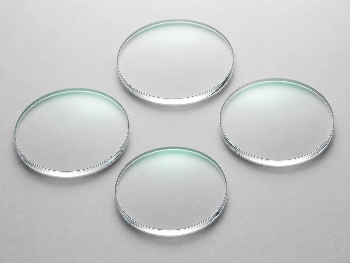 1.499 CR-39 Clear HMC Single Vision Optical Lenses - Clear 1.499 CR-39 HMC single-vision lens blanks with subtle green anti-reflective reflections