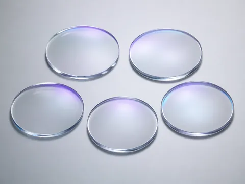 Clear optical lenses representing 1.56, 1.60, and 1.67 refractive-index options